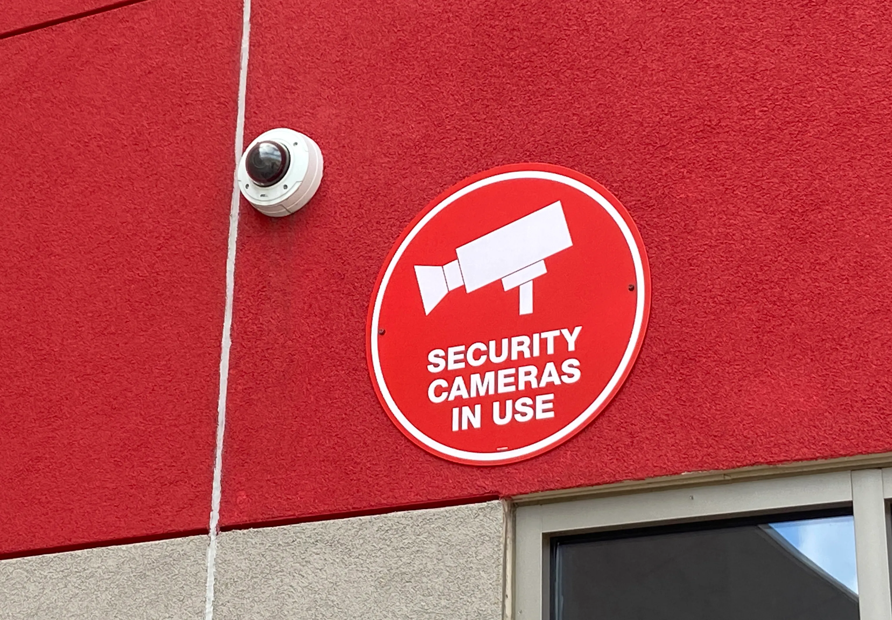 Security camera mounted on a commercial building